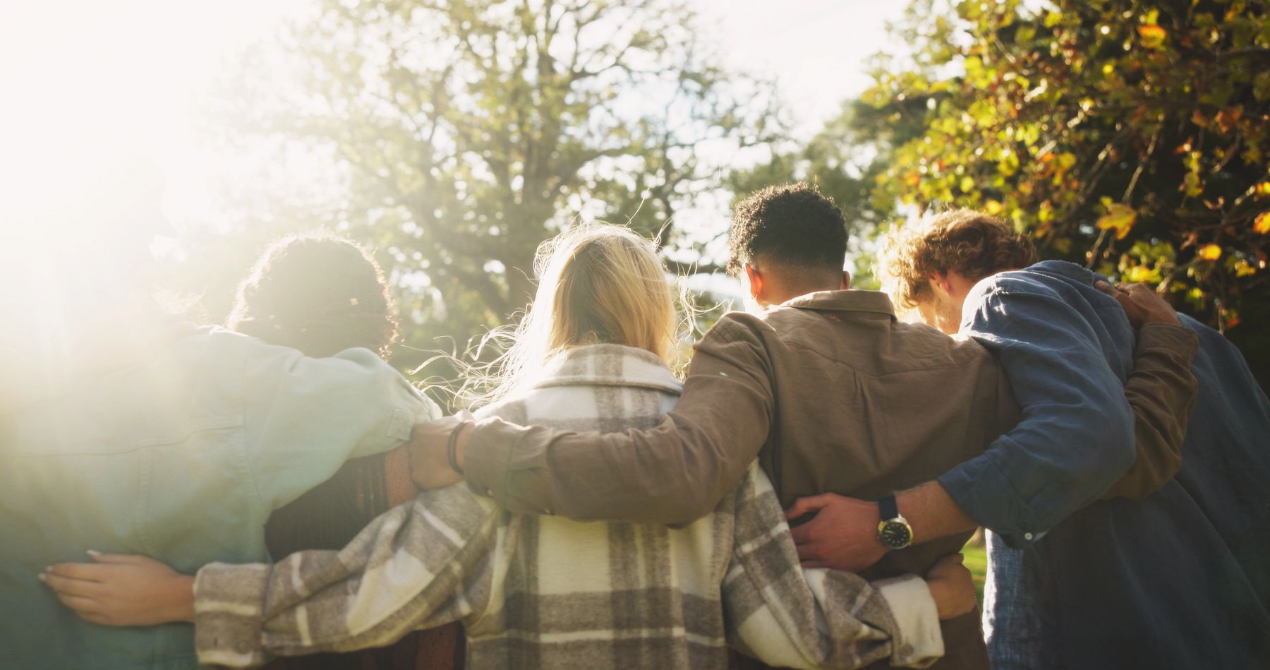 A diverse group standing together outdoors